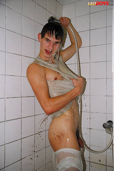 Twink Robbie undressing and showing nice ass in shower