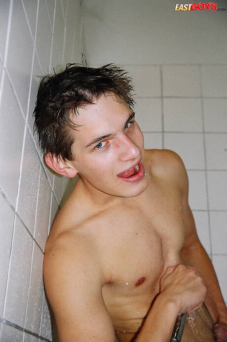 East Boys: Twink Robbie undressing and showing nice ass in shower