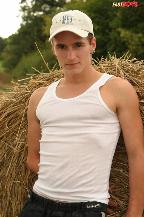 Beautiful boy Jimmy shows a beautiful body outdoor