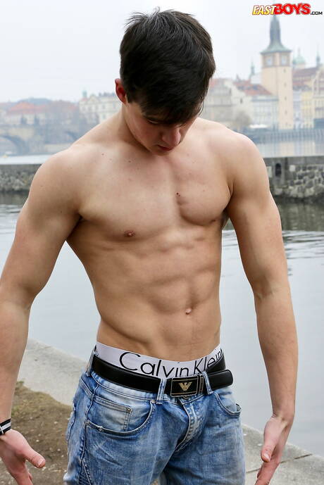 Strongman Kent Mills posing naked outside