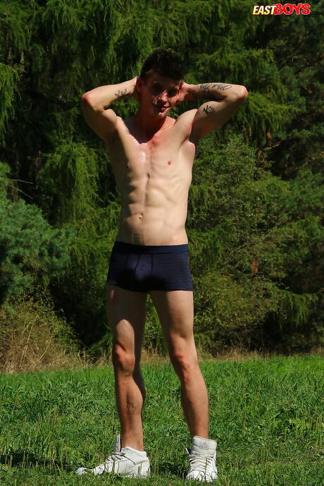 Young Alexander Dorch undressing and showing tight butt outdoor