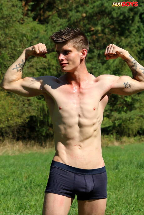 Young Alexander Dorch undressing and showing tight butt outdoor