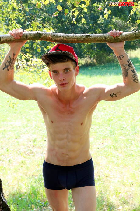 Young Alexander Dorch undressing and showing tight butt outdoor