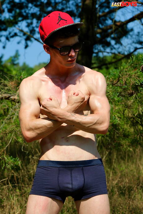 Young Alexander Dorch undressing and showing tight butt outdoor