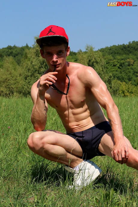 East Boys: Young Alexander Dorch undressing and showing tight butt outdoor