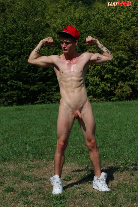 Young Alexander Dorch undressing and showing tight butt outdoor