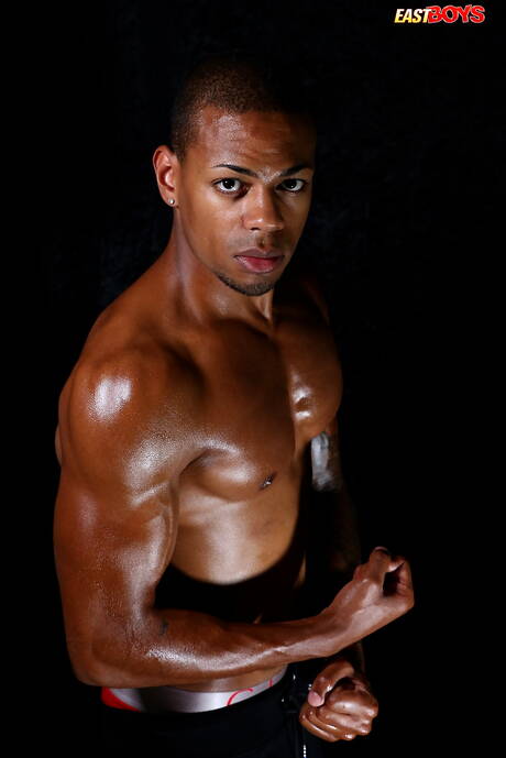 Ebony bodybuilder Omar Ali shows a muscle body