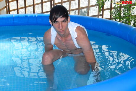 Young Dominic get naked and showing tight butt in the pool