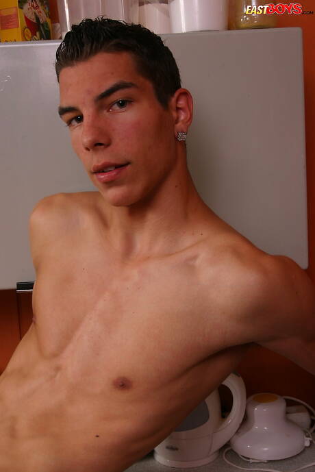 Young dude Donny shows a perfect body in kitchen